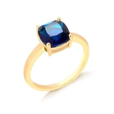 anel dourado com pedra azul
